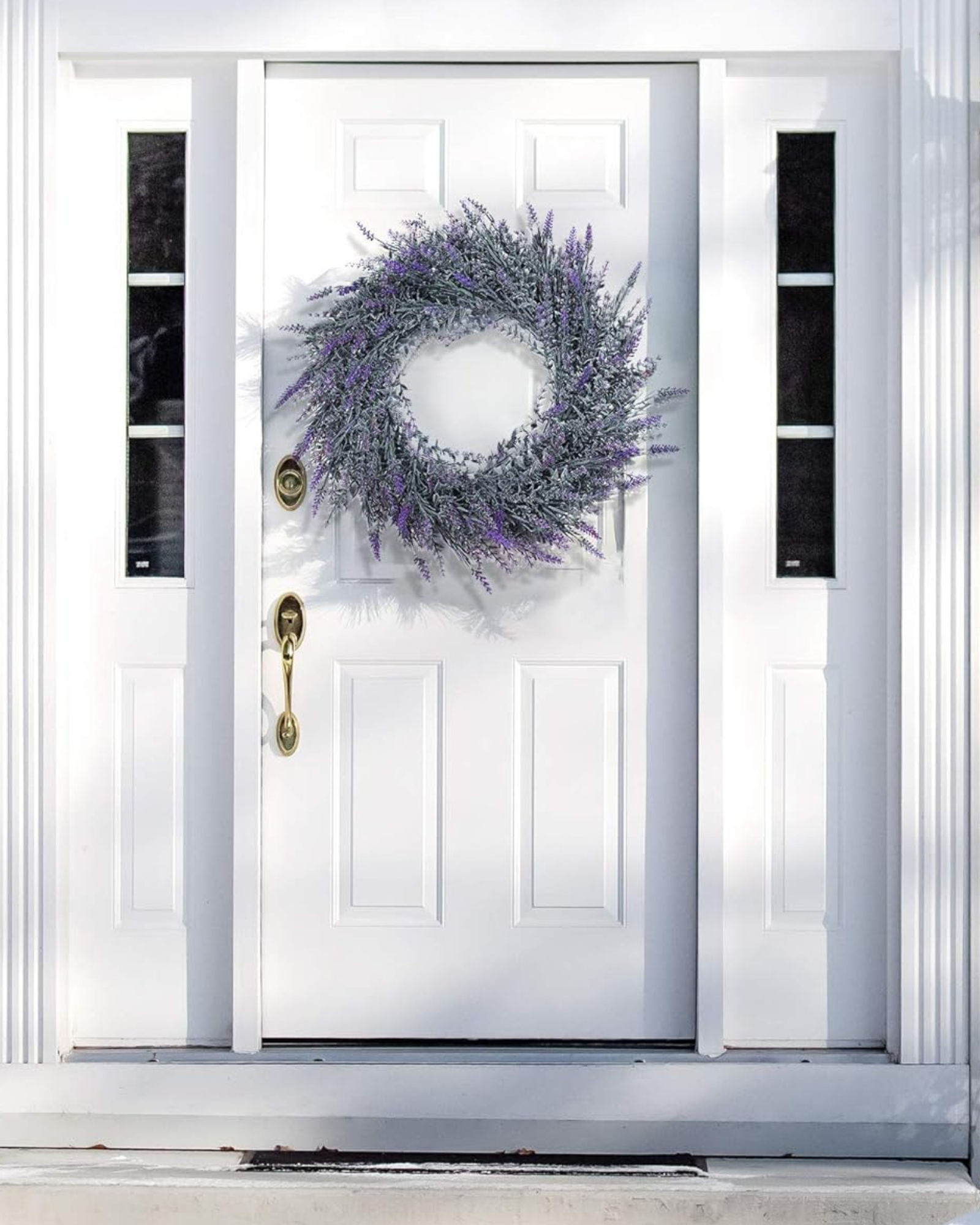 A 18 inch year round artificial lavender wreath is hanging on the front door.