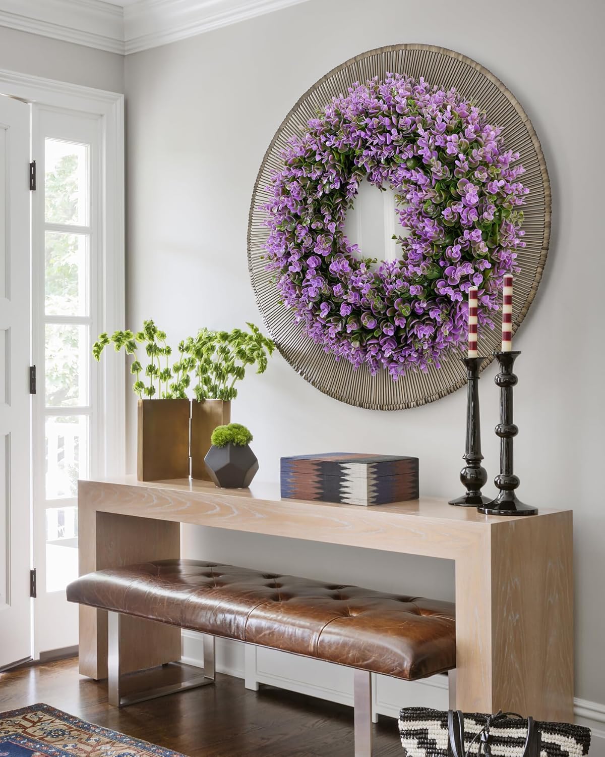 A 18 inch year round boxwood wreath is hanging on the living room.