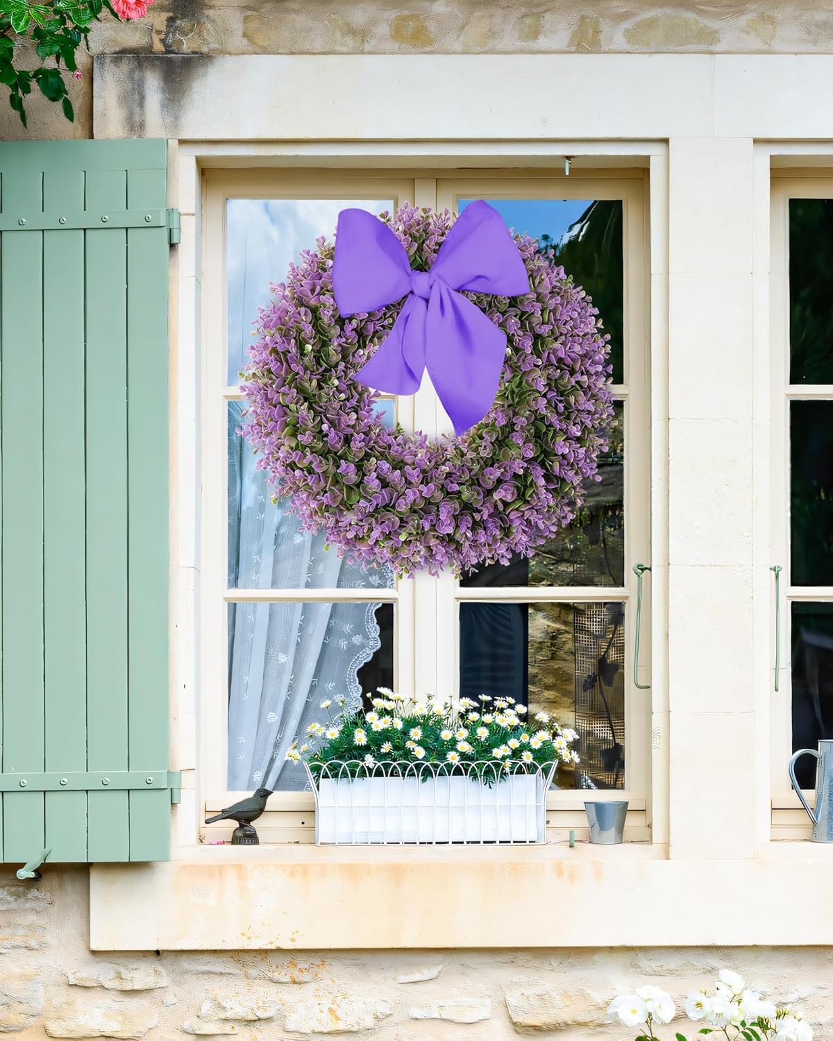 A 18 inch year round boxwood wreath is hanging on the window.
