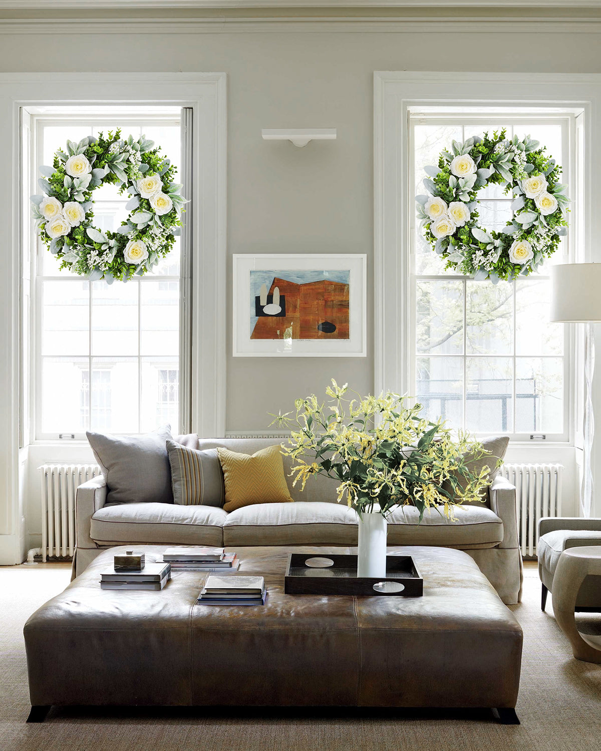There're two 20 inch Eucalyptus Boxwood Floral Wreaths hanging on the Living Room.