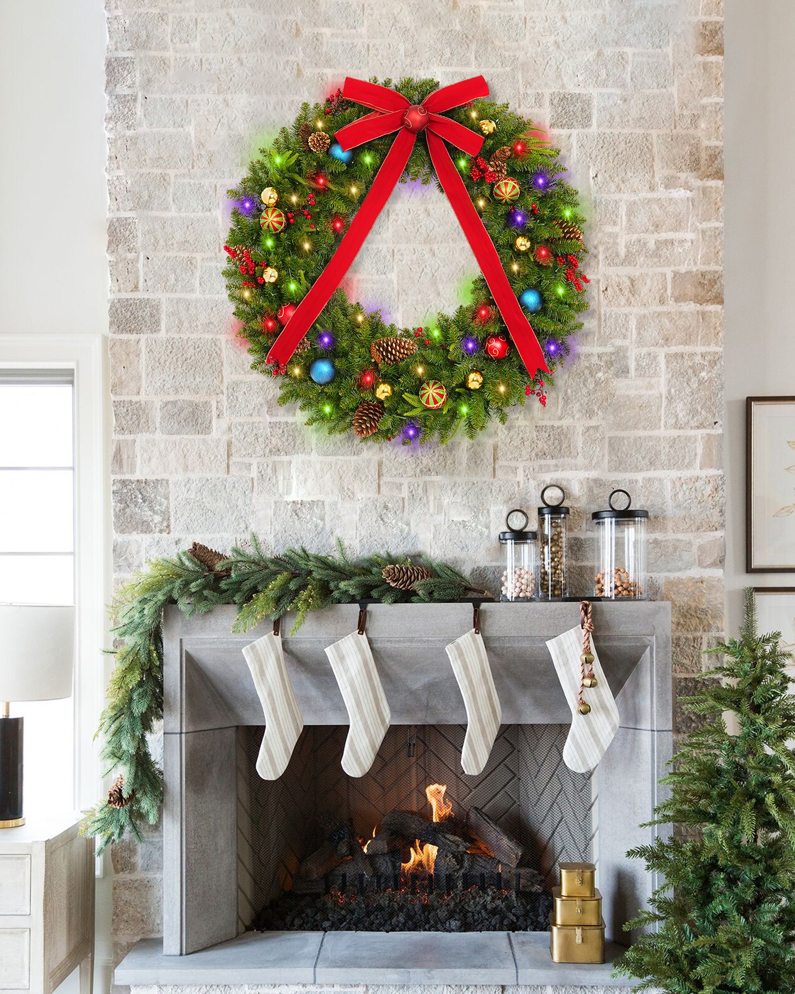 48 inch prelit large outdoor christmas wreath is hanging over the fireplace.