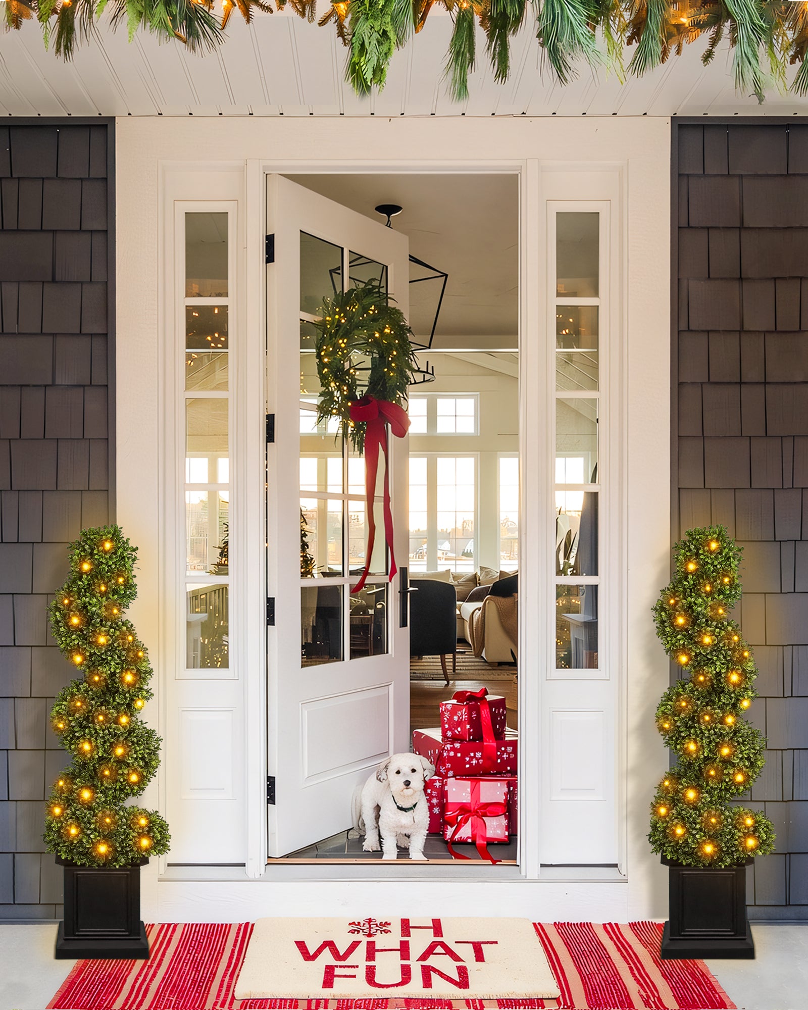 4ft spiral artificial boxwood topiary trees are standing in the front porch with lights on.