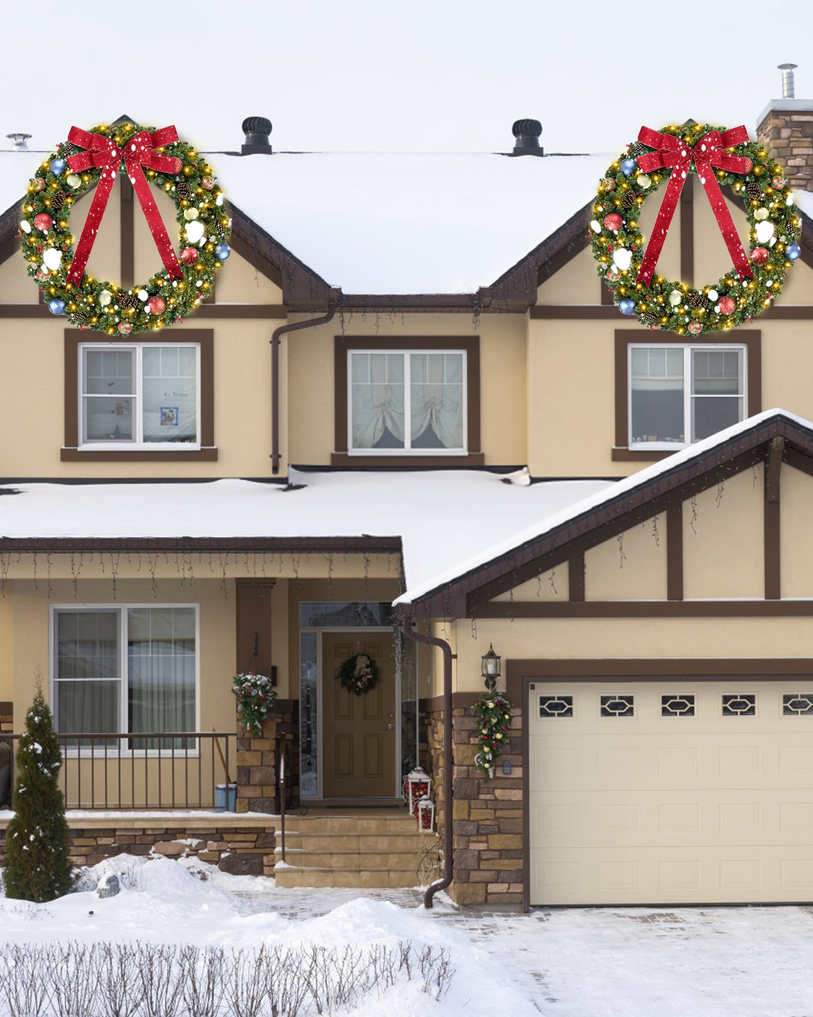 Two 60 inch prelit large christmas wreath is hanging on the front door.