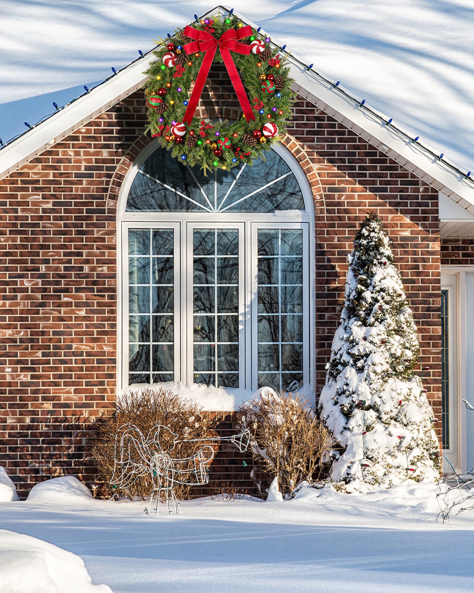 48 inch prelit large christmas wreath is hanging on the window