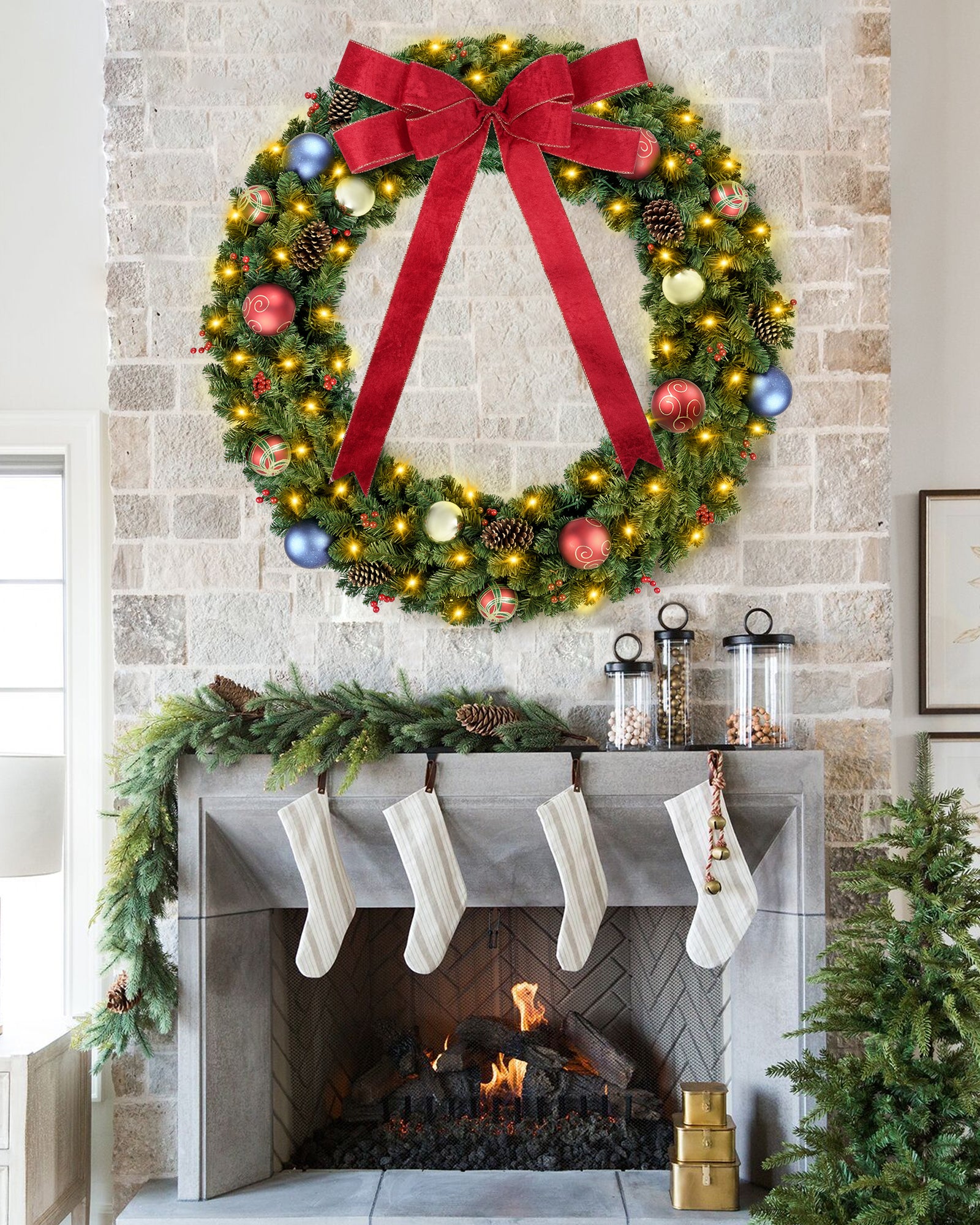60 inch prelit large christmas wreath is hanging over fireplace.